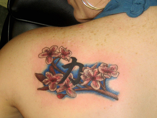 Flowered Strength tattoo