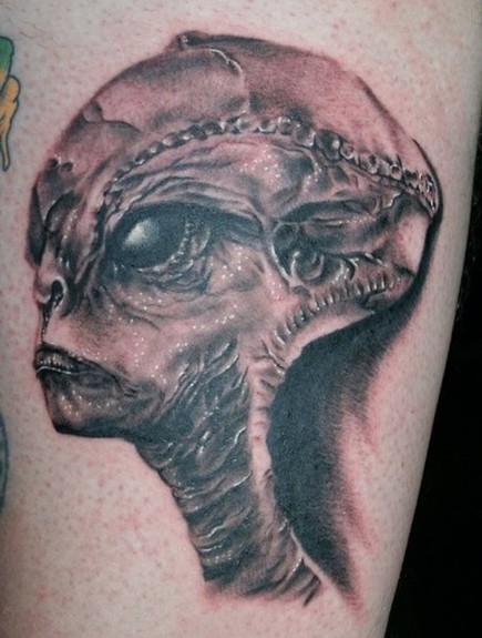 Ugly Alien Head Tattoo On Arm